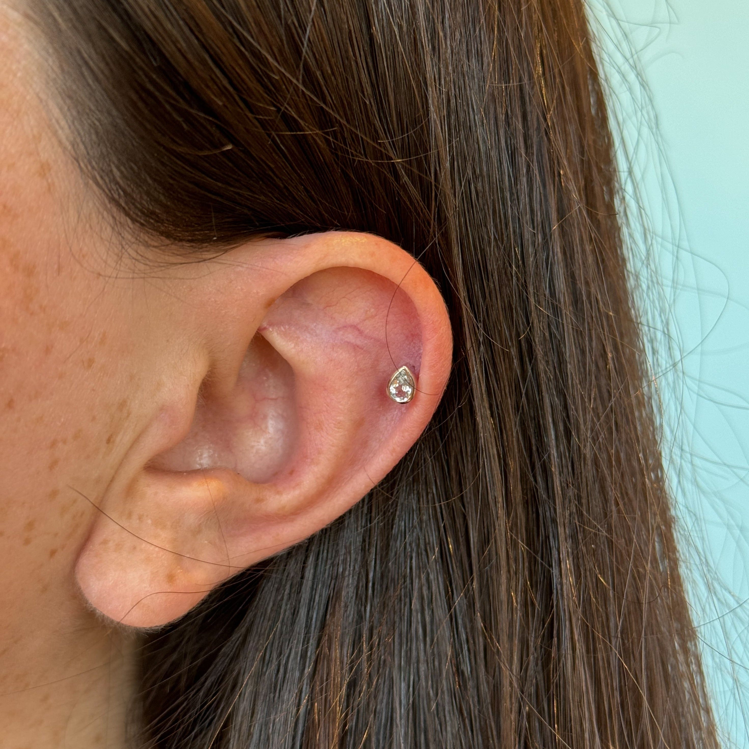 Billie White Topaz Piercings